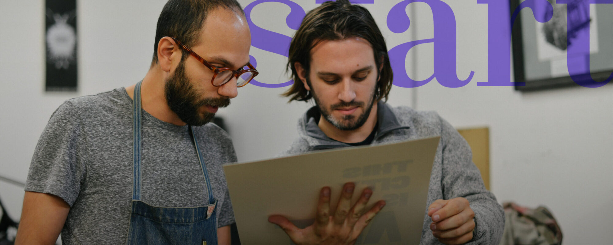 print artist looking at recent print